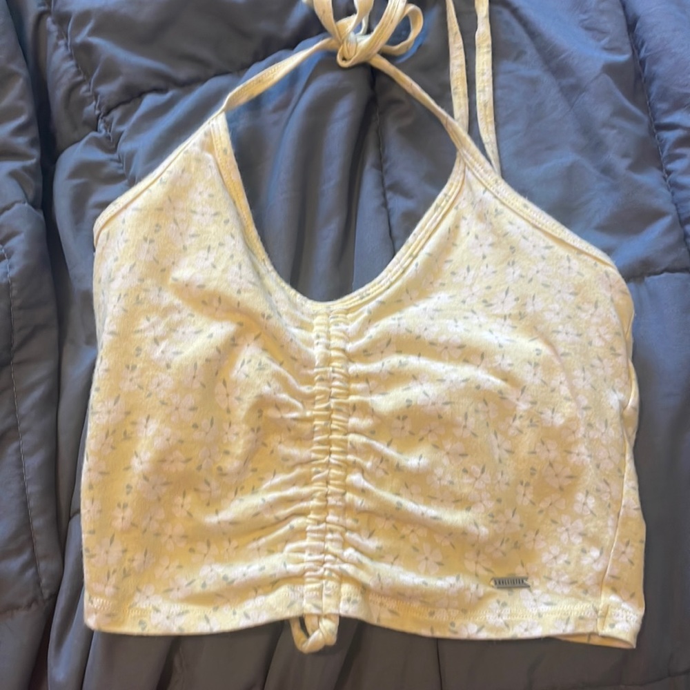 Small yellow flowered cropped halter top.